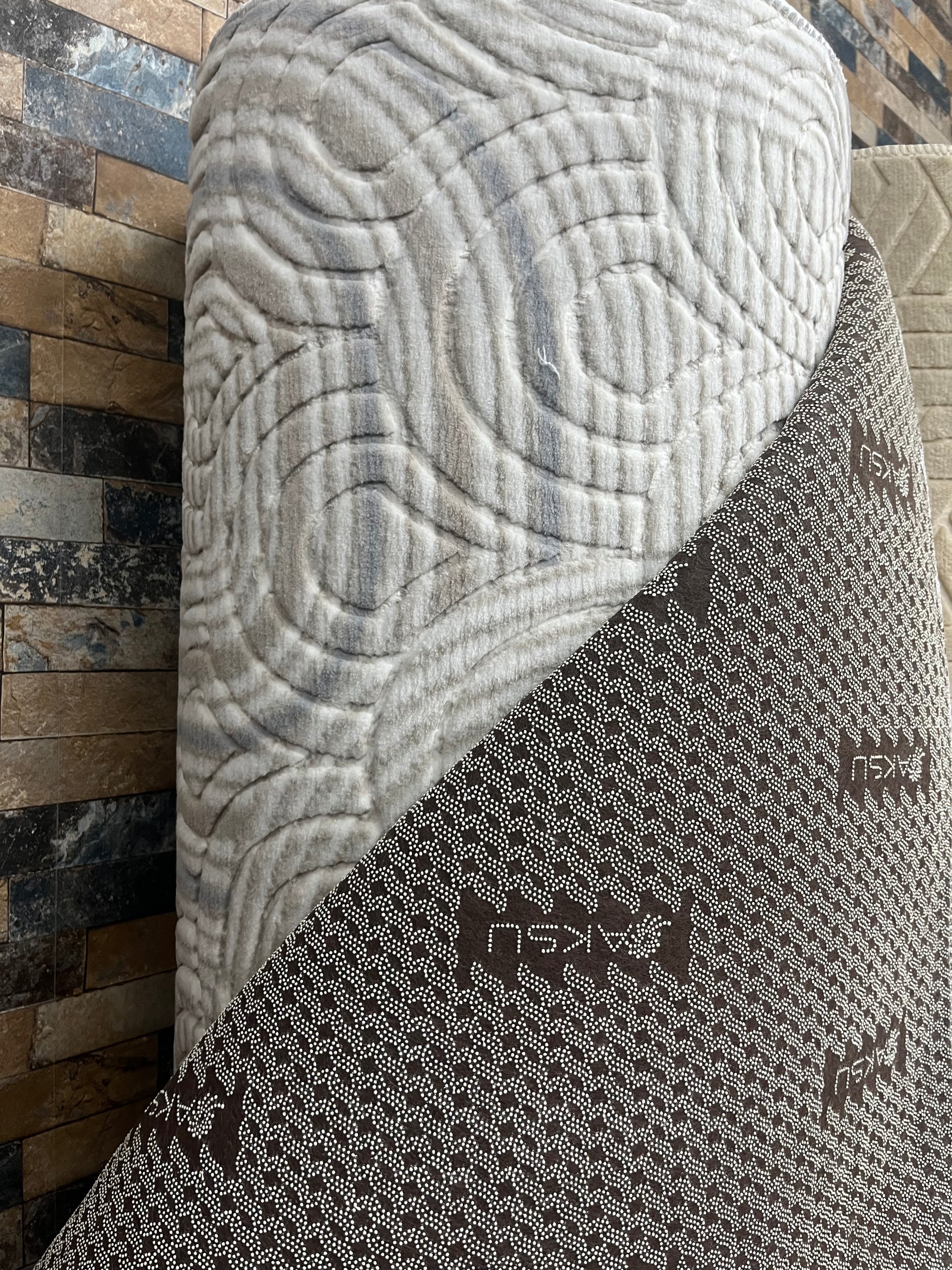 Tapis sur mesure "arc et vague" Ardasia